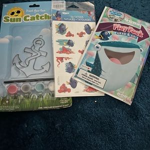 Dory tattoos, play pack and anchor sun catcher.